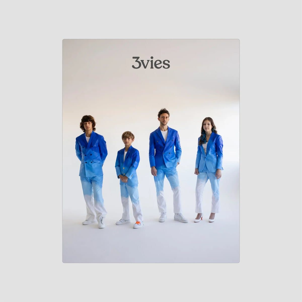 Cover of 3vies Volume 40, Mark and his three children in blue ombre hand-painted Timeless suits.