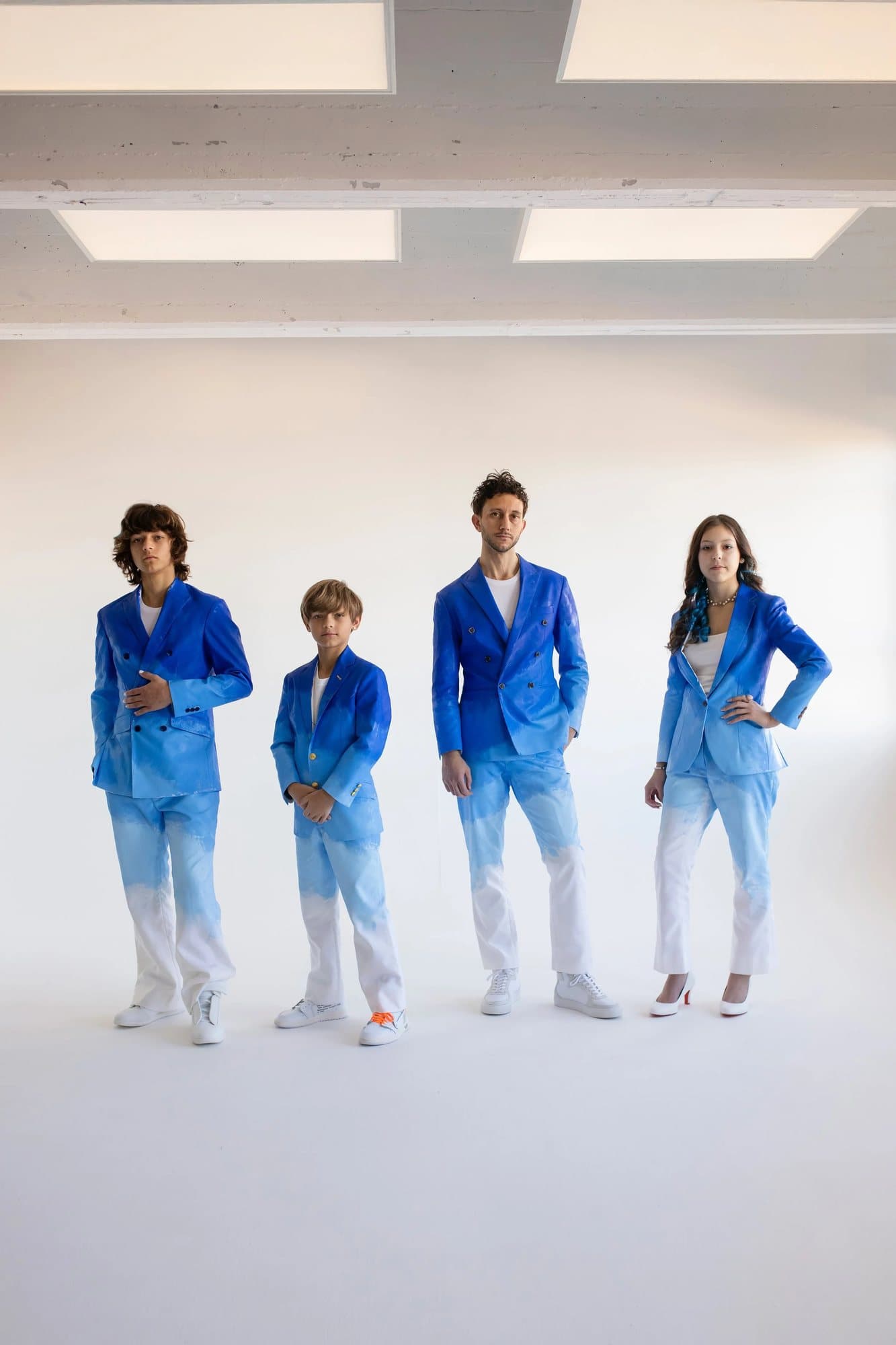 Mark and his three children in hand-painted blue ombre suits, TIMELESS print To The Future.