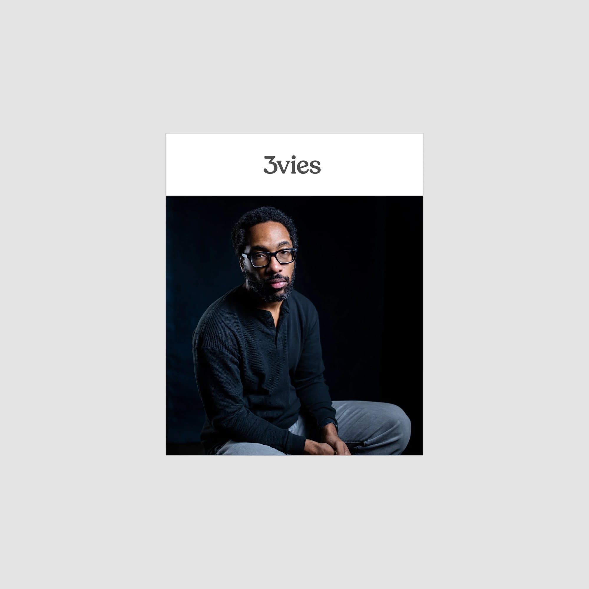 Mockup of the Volume 35 cover, a man in glasses against a dark background, on gray.